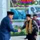 Yudian Wahyudi Disambut Adat Mopotilolo saat Tiba di Gorontalo